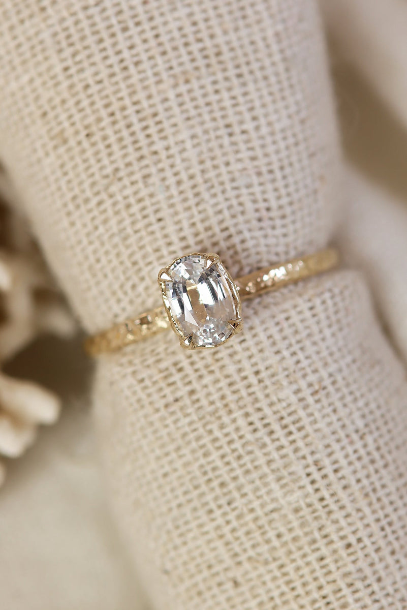 Oval Solitaire Engagement Ring With Hammered Band Texture in Solid Gold