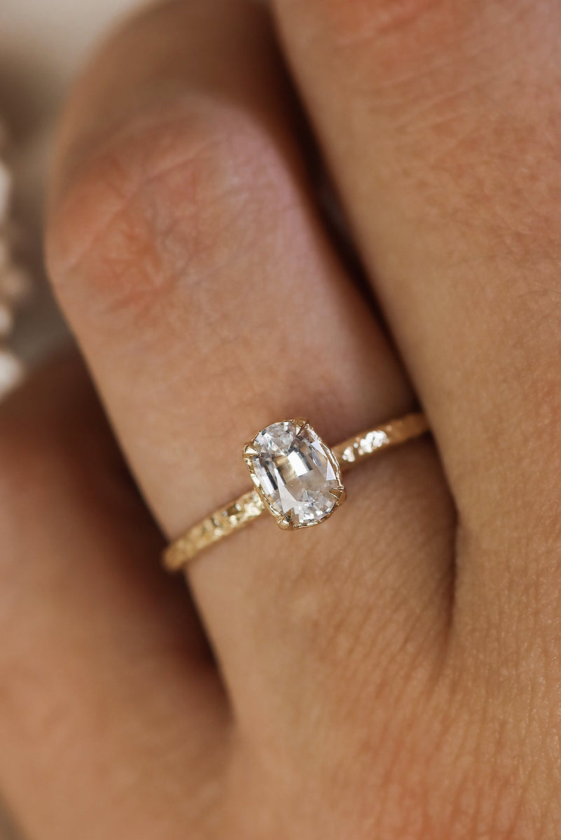 Oval Solitaire Engagement Ring With Hammered Band Texture in Solid Gold