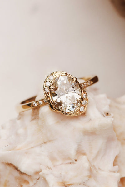 A Nature Inspired Engagement Ring Featuring an Heirloom Oval Diamond in 14k Yellow Gold