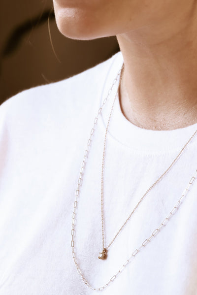 Dress up your simple white tee with layered necklaces for an easy everyday look
